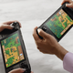Two people playing Stardew Valley on a Steam Deck, which has been delayed to February